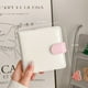 thumbnail image 3 of Álbum de fotos de 3 pulgadas con cuatro cuadrículas y hojas sueltas con hebilla magnética de PU en combinación de colores rosa y blanco para guardar tarjetas pequeñas, 3 of 5