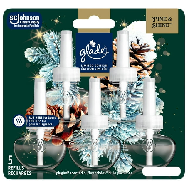 Five-pack of Glade Plugins scented oil refills in Pine & Shine fragrance with winter-themed packaging showing frosted pine cones and needles.