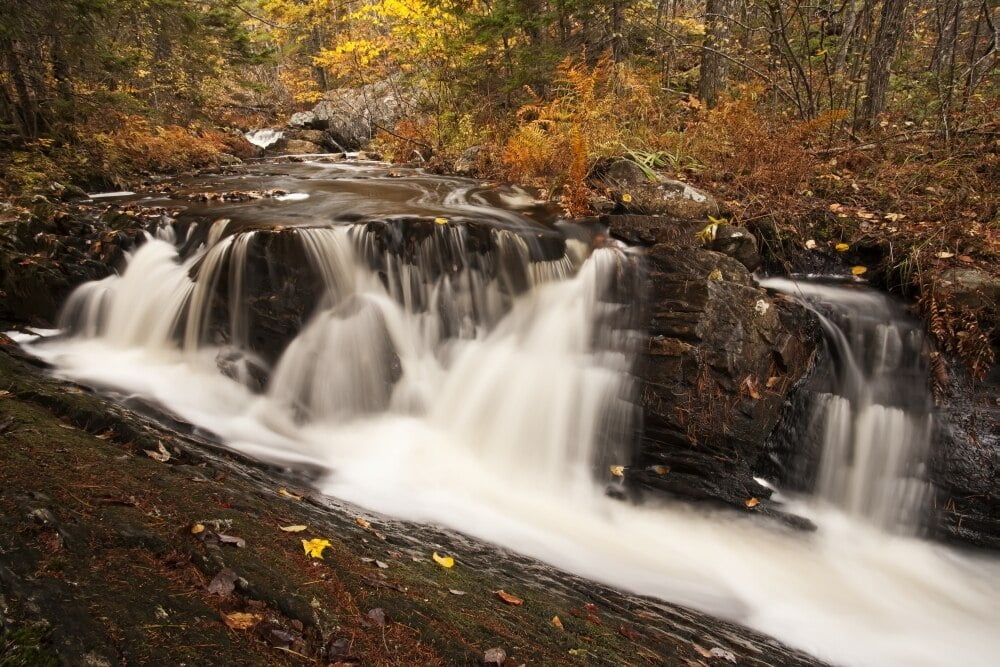 Waterfall on an autumn coloured landscape near Grand Lake; Nova Scotia