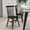 Black, variant on Merrick Lane Set of Two Premium Solid Wood Spindle Back Dining Chairs in Black with Saddle Seats and Floor Protectant Felt Pads