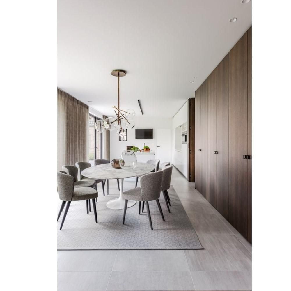 Bria Elegant Oval Dining Table with Carrara Marble Top and White Aluminum Base – A Refined and Timeless Design