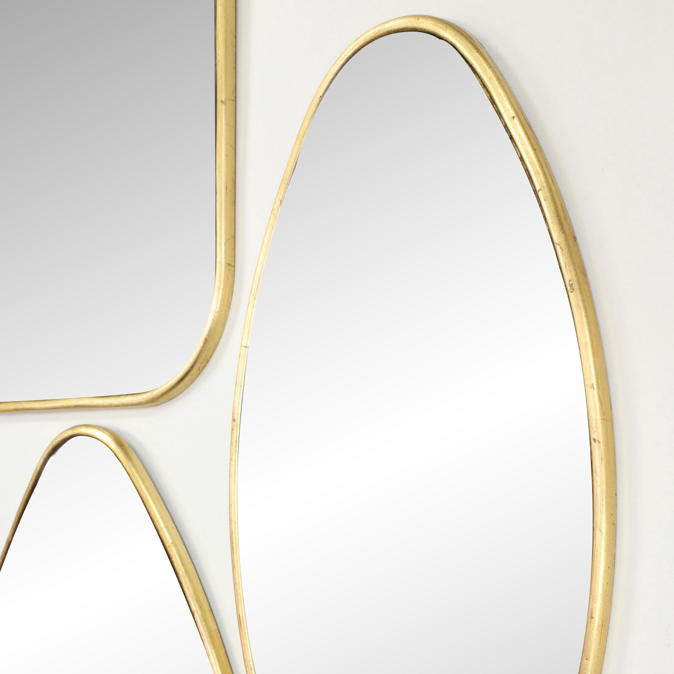 CosmoLiving by Cosmopolitan 20", 16", 21", 24"H Gold Wall Mirror with Varying Shapes, Set of 4
