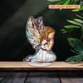 thumbnail image 6 of Rotating acrylic piece featuring a full-body praying angel with stained glass design in simple lines and photorealistic details against a white background, 6 of 7