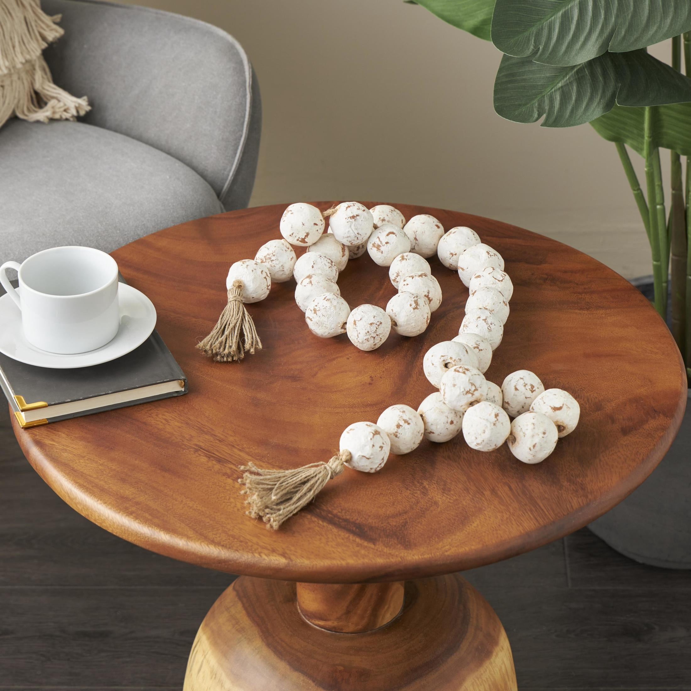 DecMode Handmade Round Intricately Shaped Large Distressed White Ceramic Garland with Tassel