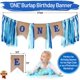 thumbnail image 5 of El primer cumpleaños del bebé está decorado con un globo con una corona de cumpleaños. Feliz cumpleaños. La silla alta tiene una pancarta de arpillera azul., 5 of 5