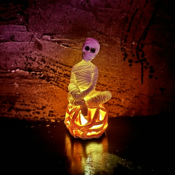 8.2" H x 3.9" W x 3.9" D mummy-inspired pumpkin resin with LED Light for decoration