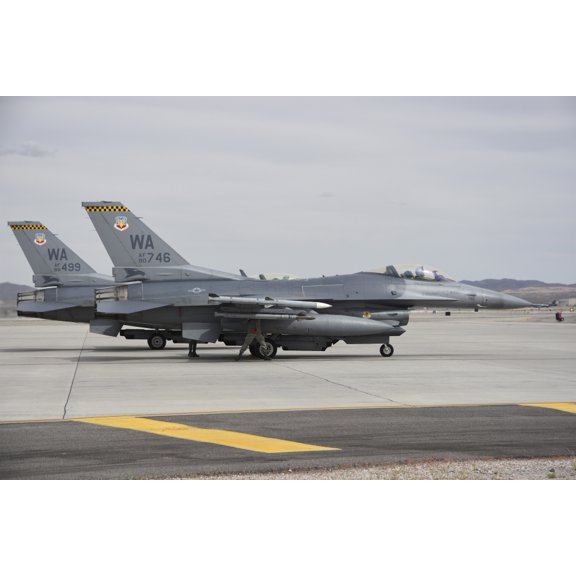 US Air Force F-16C planes undergo preflight checks at Nellis Air Force Base Canvas Art - Riccardo NiccoliStocktrek Images (34 x 23)