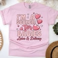 thumbnail image 1 of Women’s Graphic Tee with Heart Lollipop Design for Maternity Nurses, Light Pink, Size S, 1 of 6