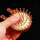 thumbnail image 2 of Cepillo de pelo de masaje ANGGREK de madera con raspador de nariz, 2 of 7