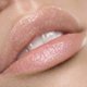thumbnail image 1 of Brillo Labial Nude Premium Voluminizador de By The Clique, 1 of 2