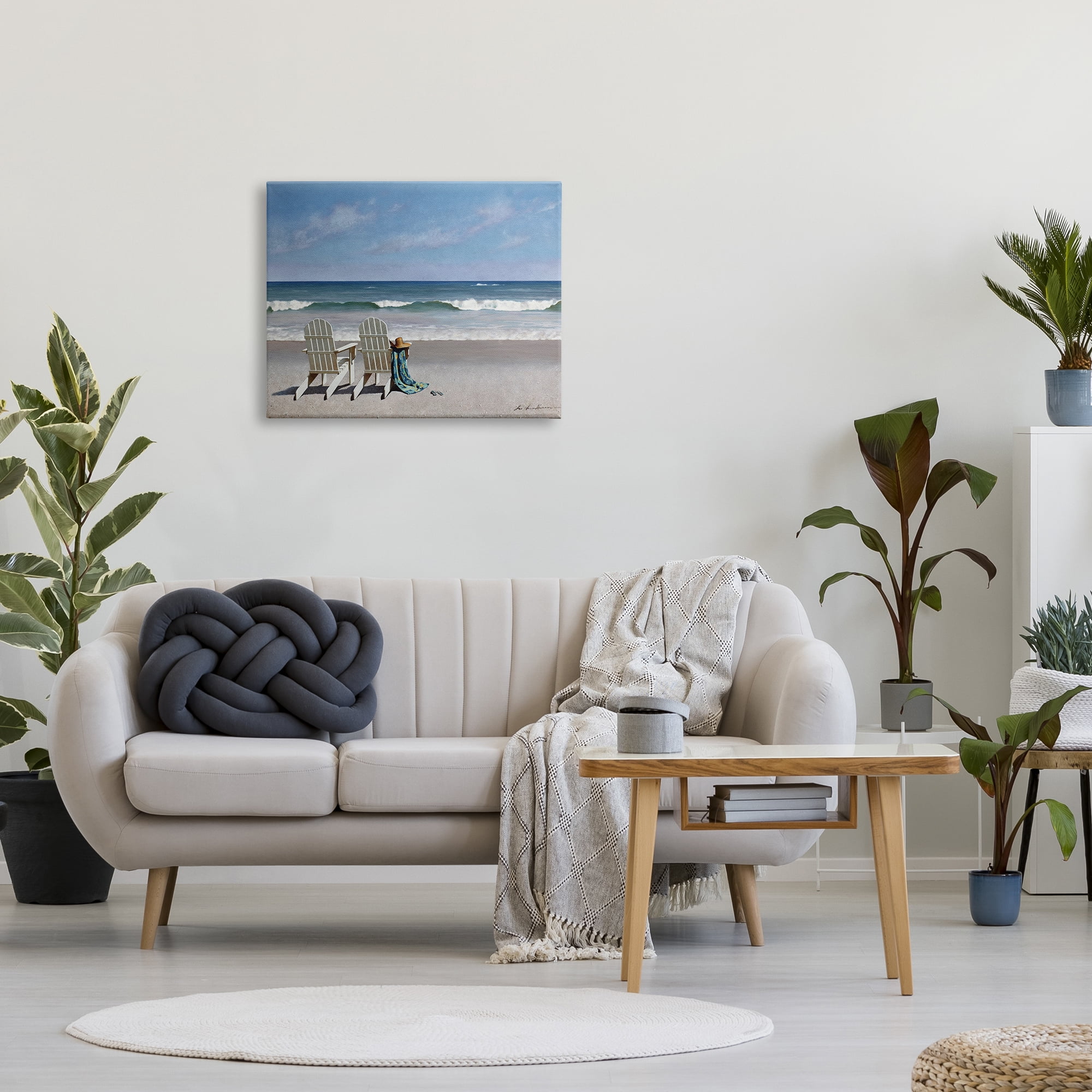The Stupell Home Decor Two White Adirondack Chairs on the Beach Canvas Wall Art