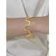thumbnail image 5 of Brazalete rígido de oro laminado con diseño de ondas abstracto, 5 of 8