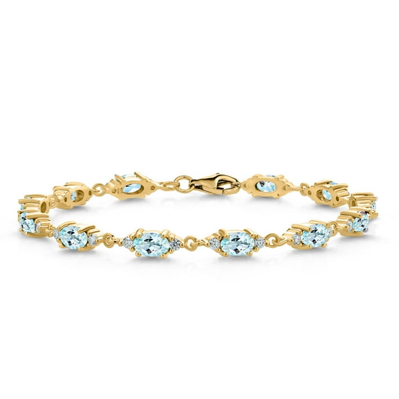 Gem Stone King 18K Yellow Gold Plated Silver Sky Blue Topaz and White Moissanite Tennis Bracelet for Women (6.91 Cttw, Gemstone Birthstone, Oval 6X4MM, 6.5 inch)
