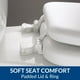 thumbnail image 4 of Asiento de inodoro acolchado, acolchado de vinilo suave sobre asiento de núcleo de madera, bisagras seguras, fácil de limpiar, alargado, color blanco, 4 of 13
