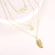 thumbnail image 3 of COLLAR TRIPLE CON PLUMA, ESTRELLA, AROS 14K dorado Unitalla, 3 of 5