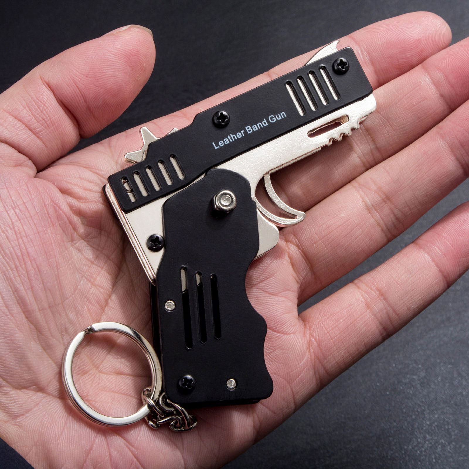 Pack De 2 Mini Pistolas De Gomas Metálicas Plegables - 6 Disparos, Llavero Y 120 Bandas - Juguete Al Aire Libre