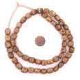 thumbnail image 2 of The Bead Chest Carved Eye Kenya Brown Bone Beads Small 9mm African Cylinder Large Hole 25 Inch Strand Handmade, 2 of 4