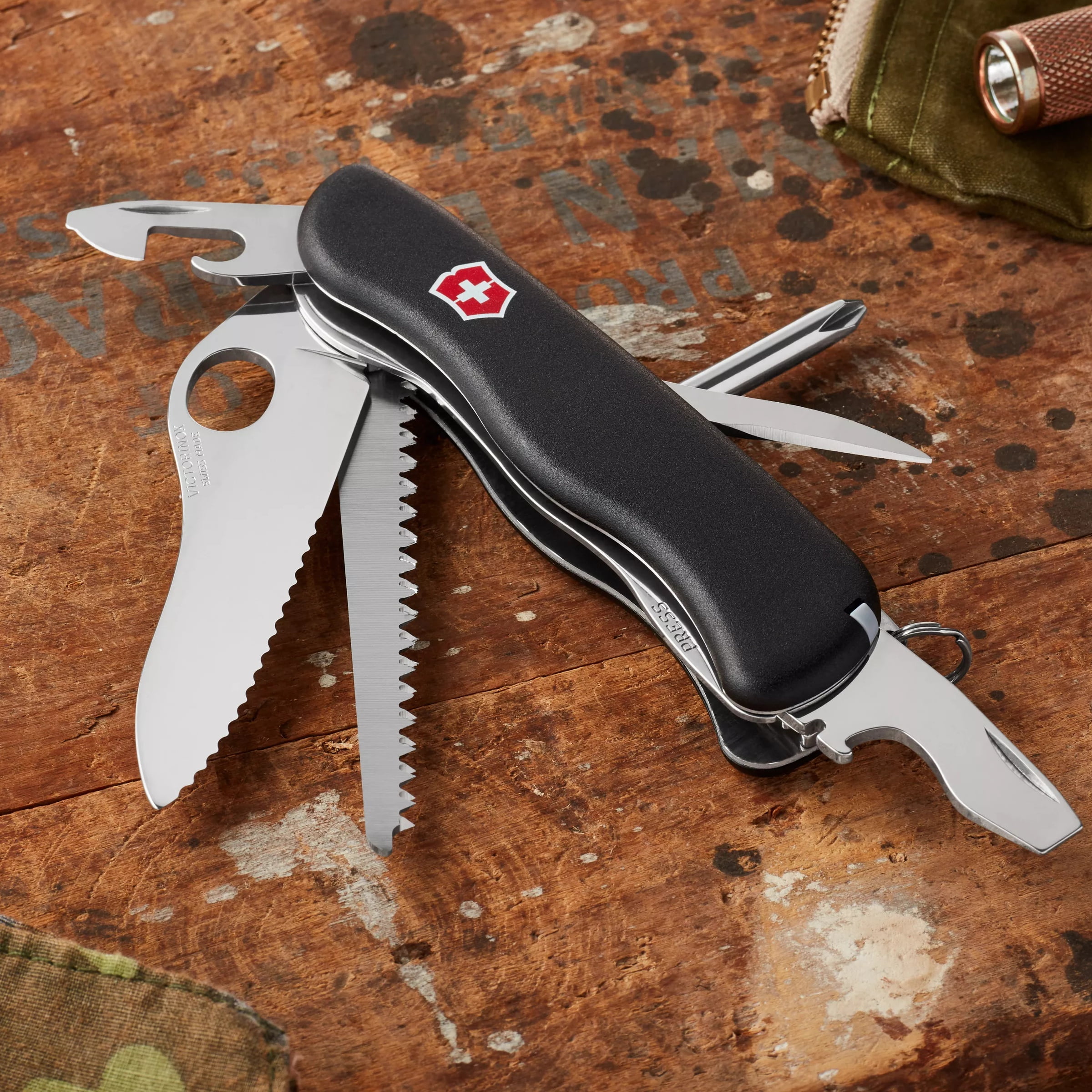 Victorinox One Hand Trekker Lockblade Swiss Army Knife, 12 Function Pocket Knife with Large Serrated Blade, Wood Saw and Screwdriver - Black, Boxed