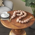 thumbnail image 2 of DecMode Handmade Round Intricately Shaped Large Distressed Orange Ceramic Garland with Tassel, 2 of 11