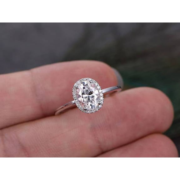 Oval cut Moissanite and Diamond Halo Engagement Ring in 10k Rose Gold