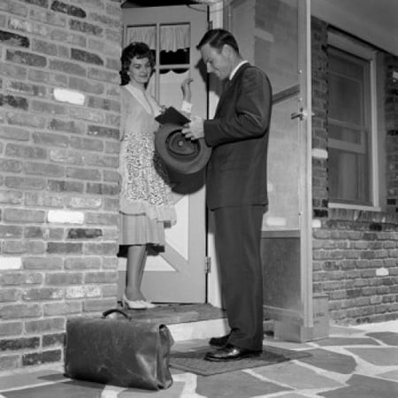 Salesman with woman at front door Poster Print