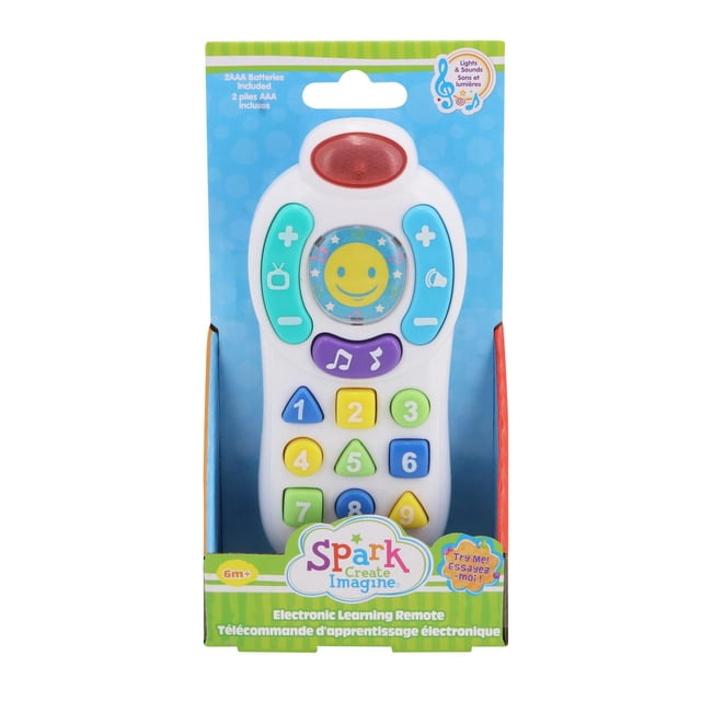 Spark Create Imagine Electronic Learning Remote toy in packaging, white plastic with colorful number and shape buttons 1 to 9, purple music button, turquoise and blue volume and channel controls, red light on top, designed for toddlers 6 months and up with interactive play modes, built-in lights, sounds, and melodies, batteries included.