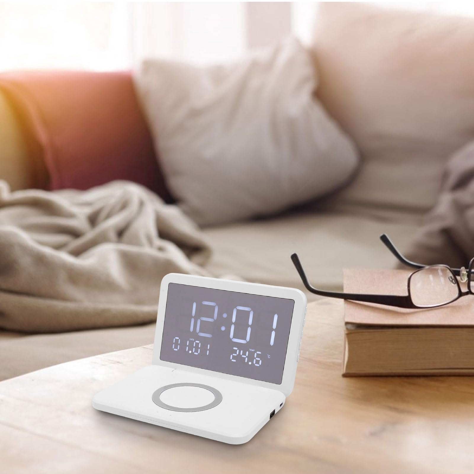 The Nidmaw digital clock features wireless charging, a foldable alarm clock, and an LED mirror display for showing the calendar and temperature. Suitable for bedrooms, desks, living room coffee table