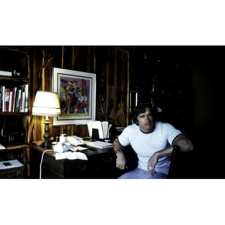 Arnold Schwarzenegger in the library of his home Photo