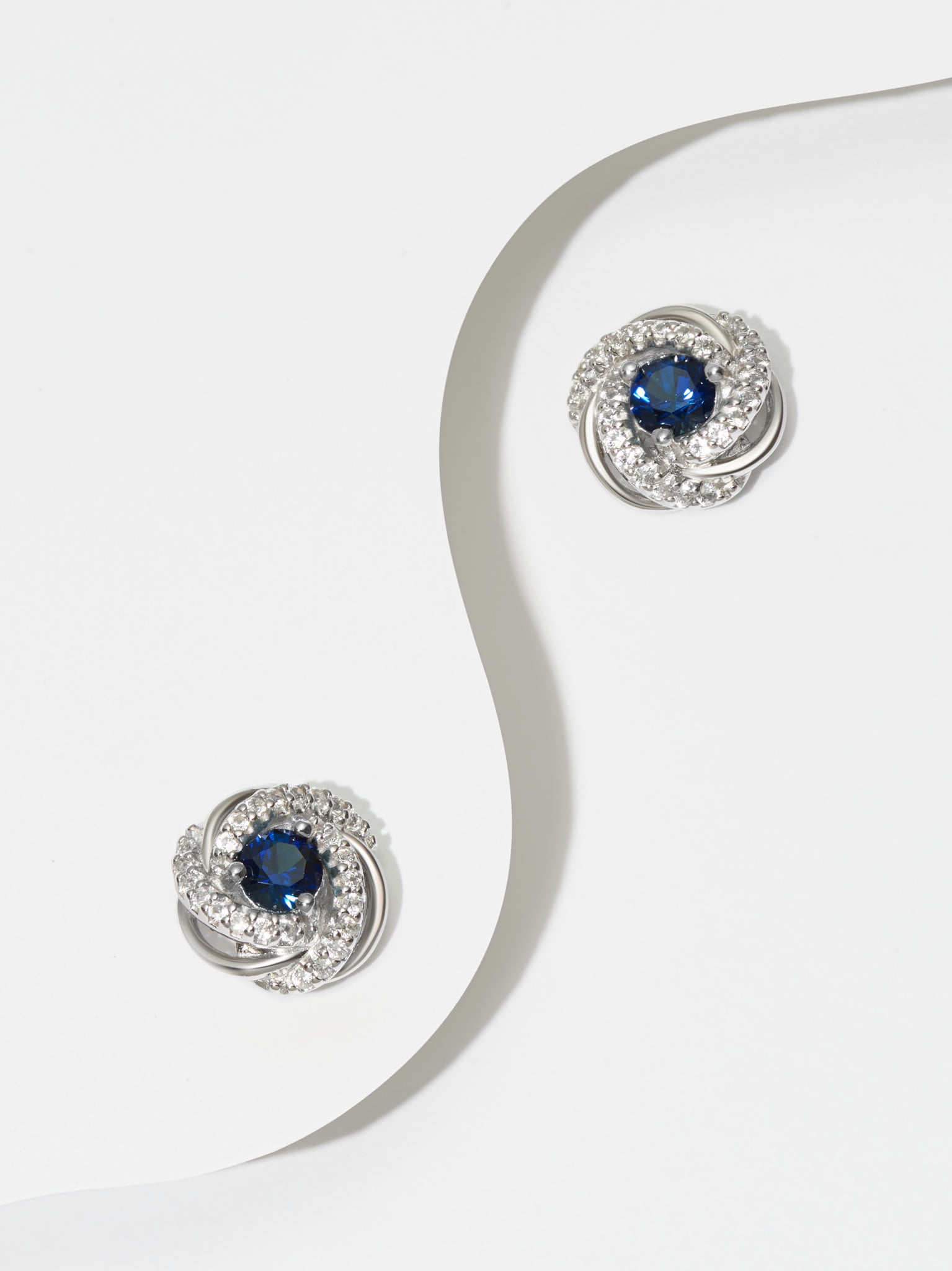 Rhodium Plated Sterling Silver Created Blue Sapphire September Birthstone Love Knot Stud Earrings for Women Gift for Her