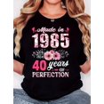 thumbnail image 1 of Women's Retro 1985 Floral Print T-Shirt - "Made in 1985" Design with Pink Flowers & Green Leaves, Casual Comfort Fit, Short Sleeve Crew Neck, Soft Fabric, Machine Washable, Allseason Apparel | Round, 1 of 6