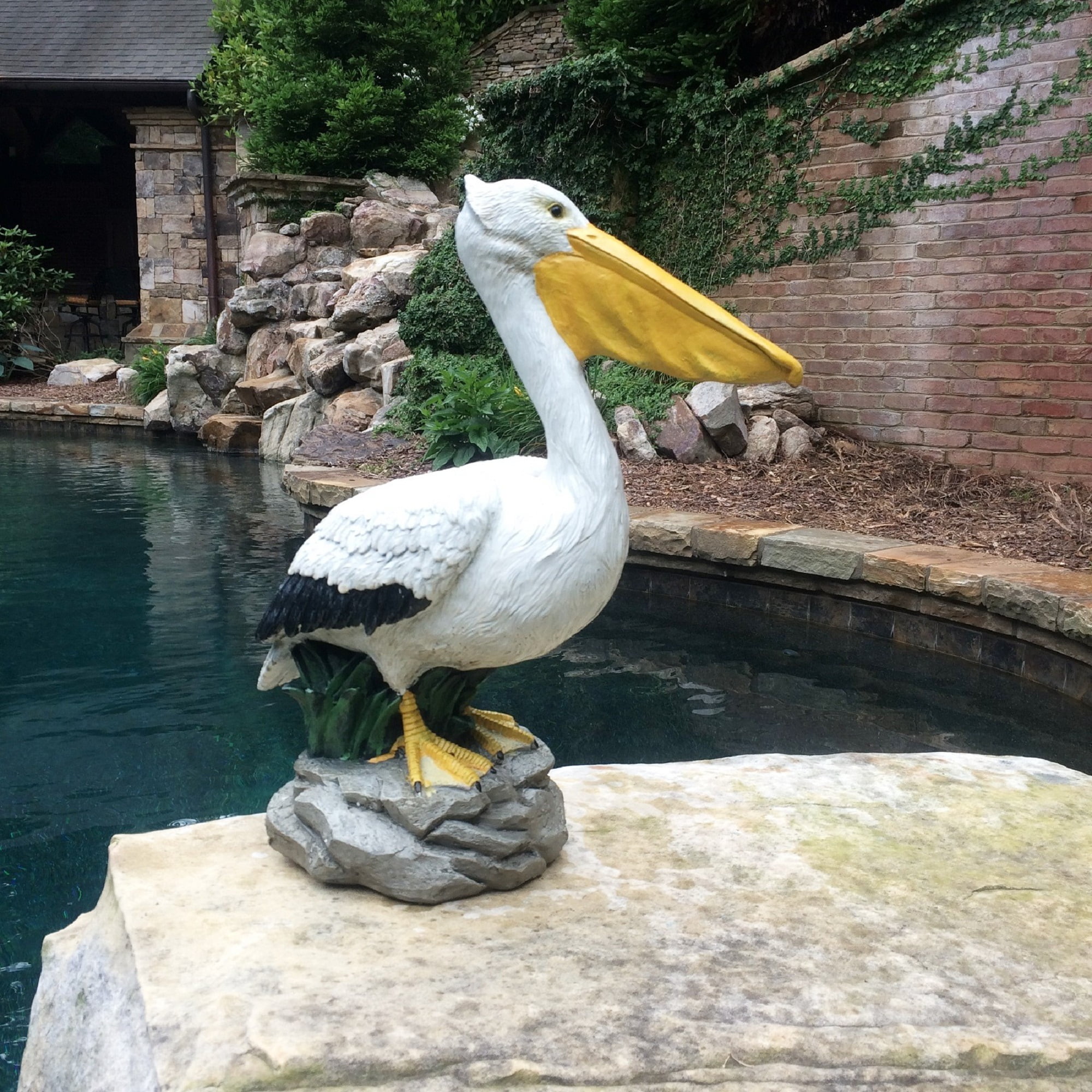 Homestyles 20 in. Pelican on Coastal Rock with Natural Finish Nautical Beach Statue Garden Statue