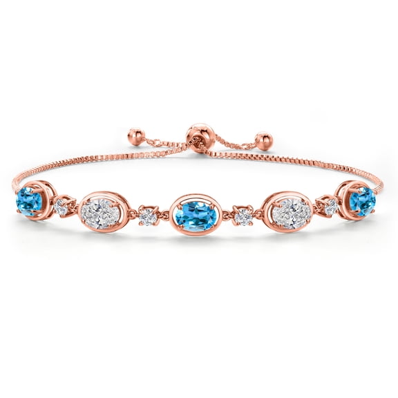 Gem Stone King 18K Rose Gold Plated Silver Swiss Blue Topaz and White Lab Grown Diamond Bracelet for Women | 4.40 Cttw | Gemstone November Birthstone | Oval 7X5MM | Fully Adjustable 9 inch