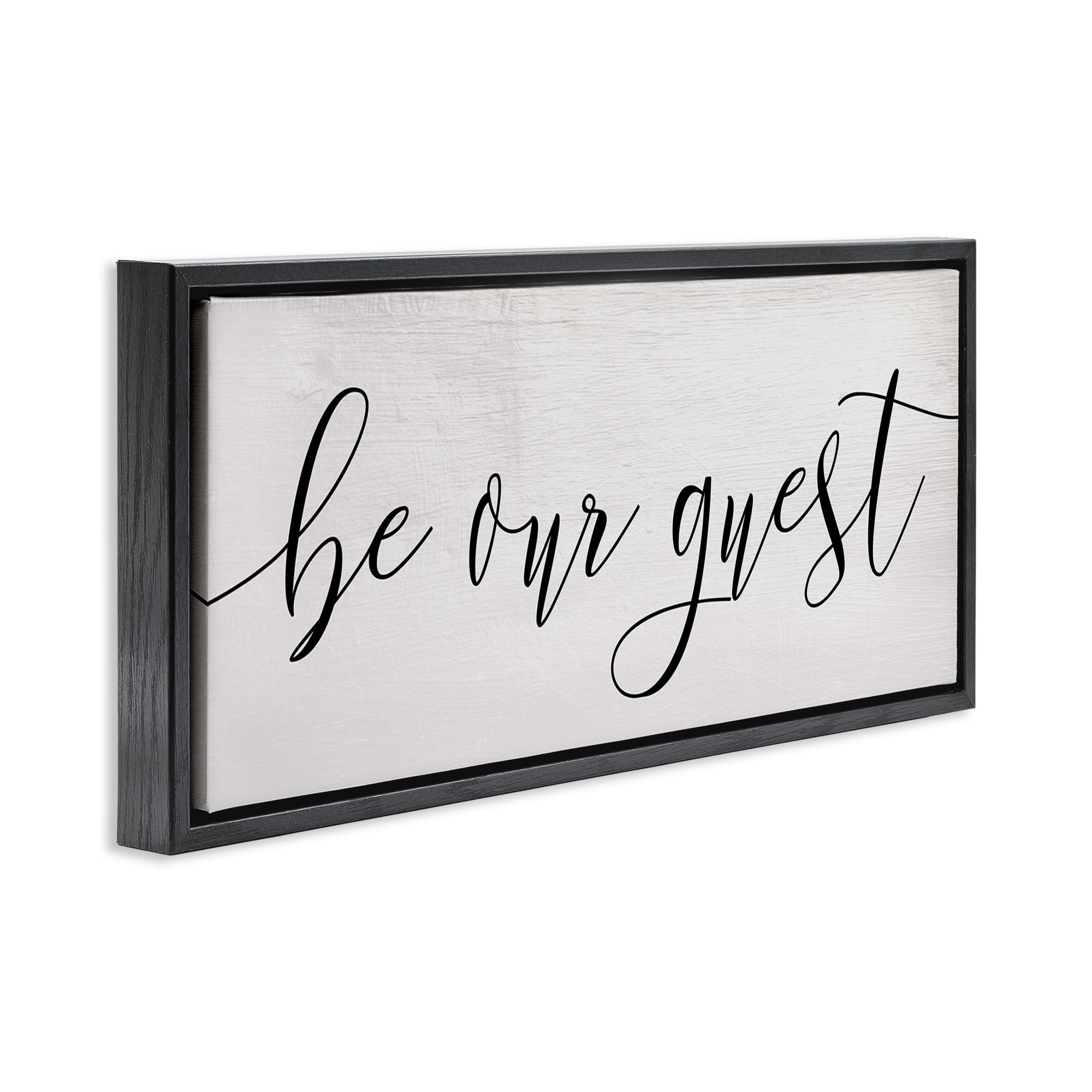 Stupell Industries Be Our Guest Script Inspirational Painting Black Floater Framed Canvas Art Print Wall Art, 25 x 11