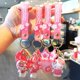thumbnail image 4 of Sanrio-llavero de flor de cerezo de gatito Kawai, colgante de colección, Cinnamoroll Kawaii, Kuromi My Melody para decoración de bolsos de niña rosa, 4 of 5