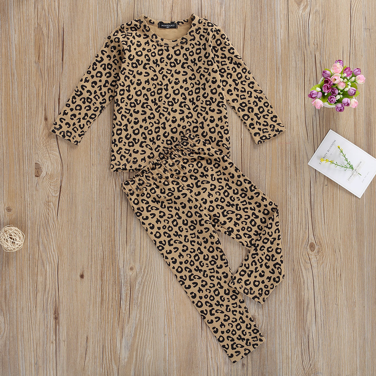 leopard print baby sleepsuit
