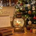 thumbnail image 2 of Christmas Musical Snow Globe Lantern, Water Filled Night Light, Oil Lamp Style Body with Swirling Glitter Warm Light and Eight Melodies, Tabletop Decor for Mantel Shelf or Bedside, 2 of 6