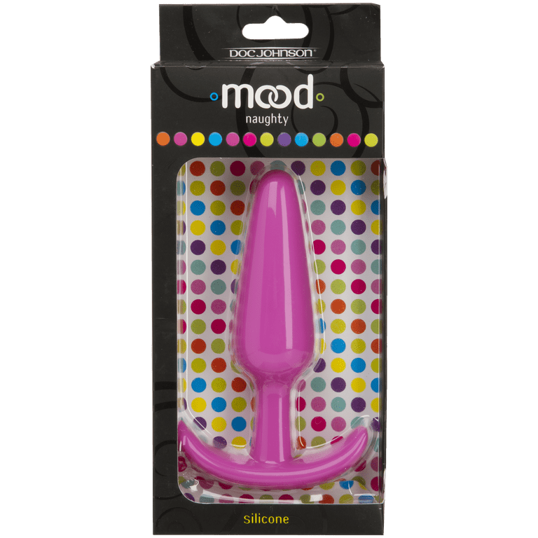 Sex toy. Black butt plag and donut on a pink background. Useful
