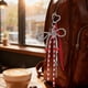 thumbnail image 5 of Accesorios para bolsos Miu con lazo rojo, llavero para coche, llavero de fibra de poliéster, 5 of 6
