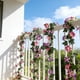 thumbnail image 1 of Guirnalda de flores artificiales de seda de 1,7 m para colgar en la pared | Guirnalda floral de imitación morada y rosa para decoración de interiores, 1 of 6