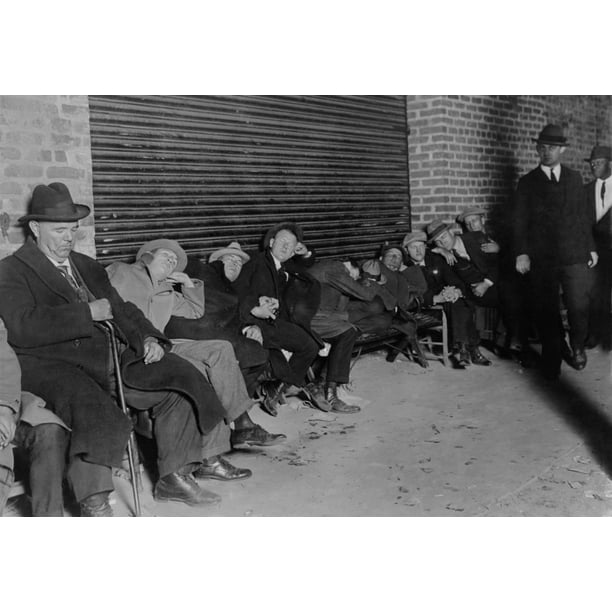Men In Business Suits Sit And Sleep In Line For Tickets For The Opening