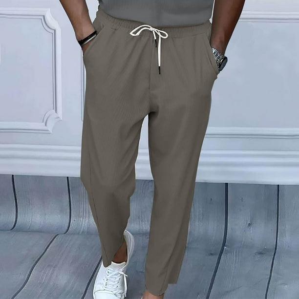 Pantalones largos para hombre con cordón, cintura elástica y bolsillo de color liso, sudadera con capucha y perneras ajustadas, pantalones de chándal de poliéster para hombre.