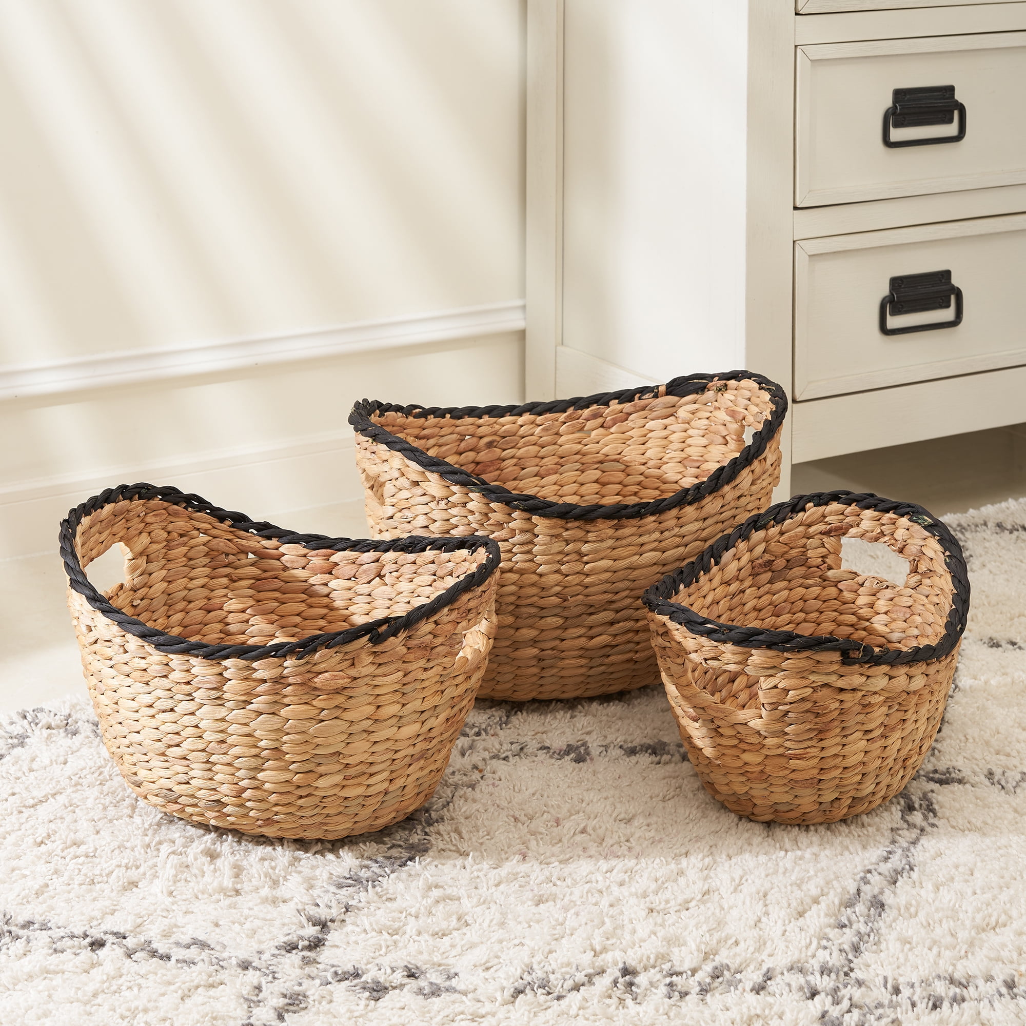 Eliana 3-piece Assorted Stackable Boat Shape Hand-woven Water Hyacinth Storage Basket Set with Black Rim and Hole Handles