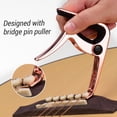 thumbnail image 3 of Capo TC-02 Capo de guitarra multifuncional Aleación de zinc con extractor de pasadores de puente Ranura para púas de guitarra 3 piezas Púas de guitarra para guitarras eléctricas acústicas Bajo Tomshoo Capo, 3 of 6