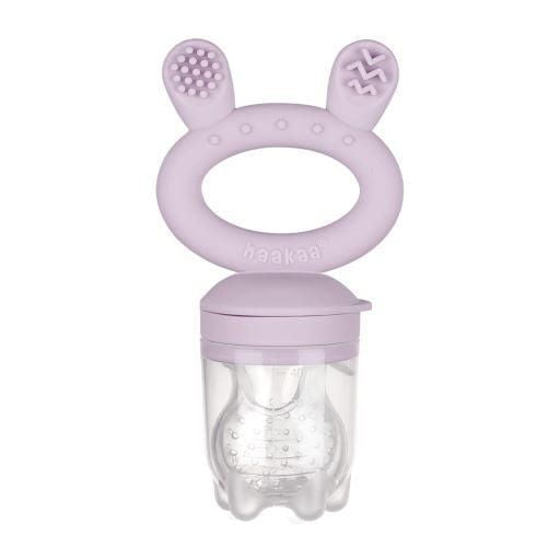 haakaa Fresh Food Feeder & Cover Set in lavender with a soft silicone handle shaped like bunny ears featuring textured teethers, and a clear silicone pouch with small holes for safe baby self-feeding, teething relief, and improved hand-eye coordination.