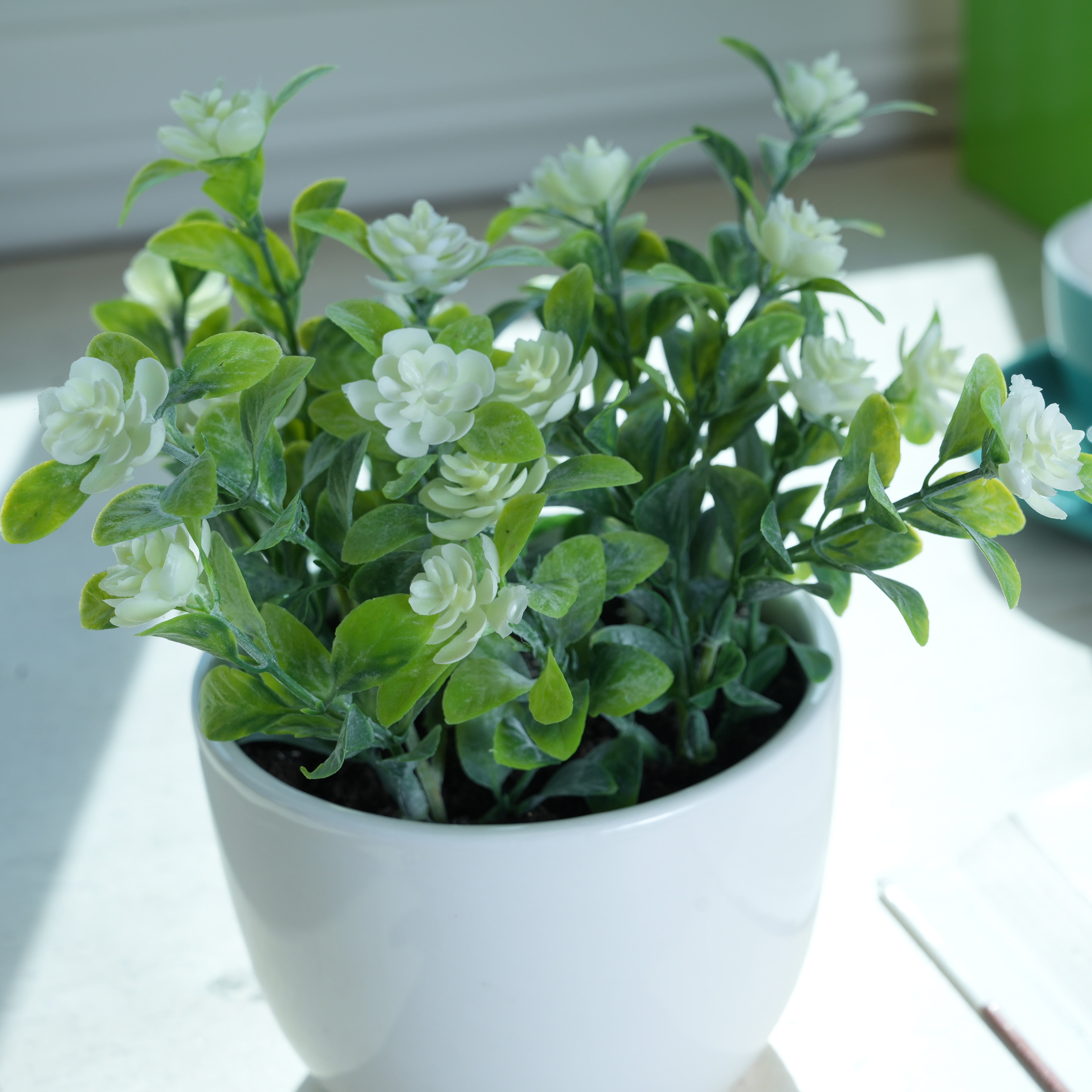 Mainstays 7.5” Artificial Eucalyptus and Flower in White Ceramic Pot Made for Tabletops – 1.1 lbs