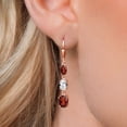 thumbnail image 3 of Gem Stone King 18K Rose Gold Plated Silver Red Garnet 3 Stone Dangle Earrings for Women (6.14 Cttw, Gemstone January Birthstone, Oval 8X6MM, 7X5MM and 6X4MM), 3 of 6
