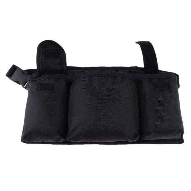 paquete unisex zulema cinturón bolsa de herramientas de cintura negro, vista frontal centrada de una riñonera de trabajo con tres compartimentos visibles en tejido sintético resistente, cierre superior con tiras de velcro y hebilla lateral, silueta rectangular compacta adecuada para trabajo y senderismo, a menudo usada para llevar herramientas pequeñas o accesorios durante actividades al aire libre.