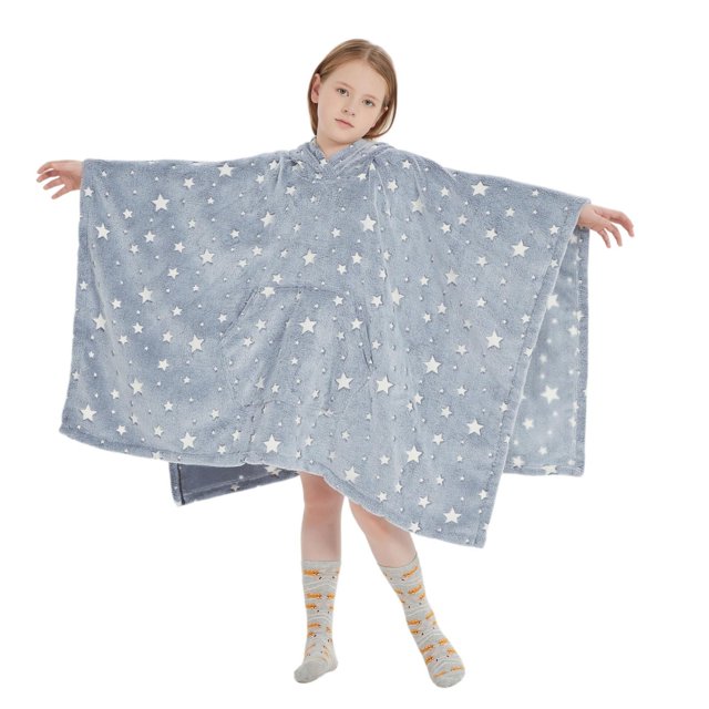 Blue plush wearable blanket hoodie for kids featuring white stars and an oversized front pocket, shown worn by child with arms extended.