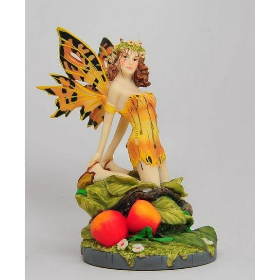 A Salons Gold Color Winged Fairy Sitting on Foliage Statue Figurine