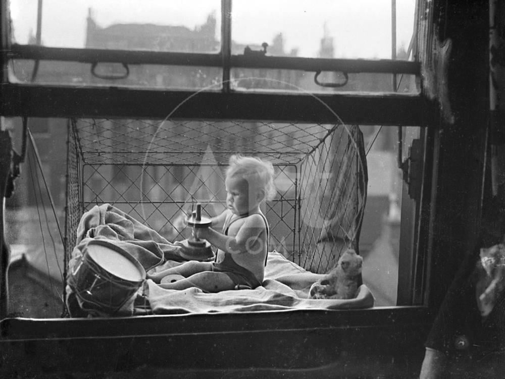 Outdoor Baby Cage, Figurative Unframed Photographic Print Wall Art Sold